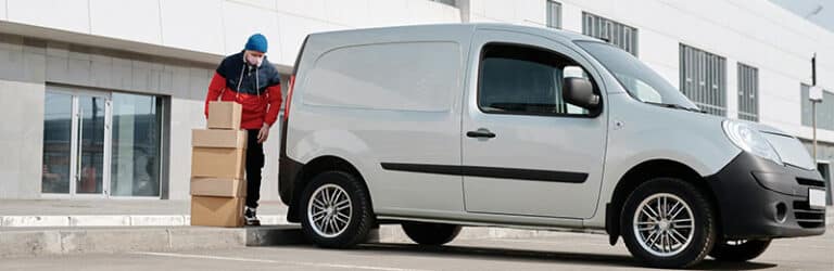 man next to van