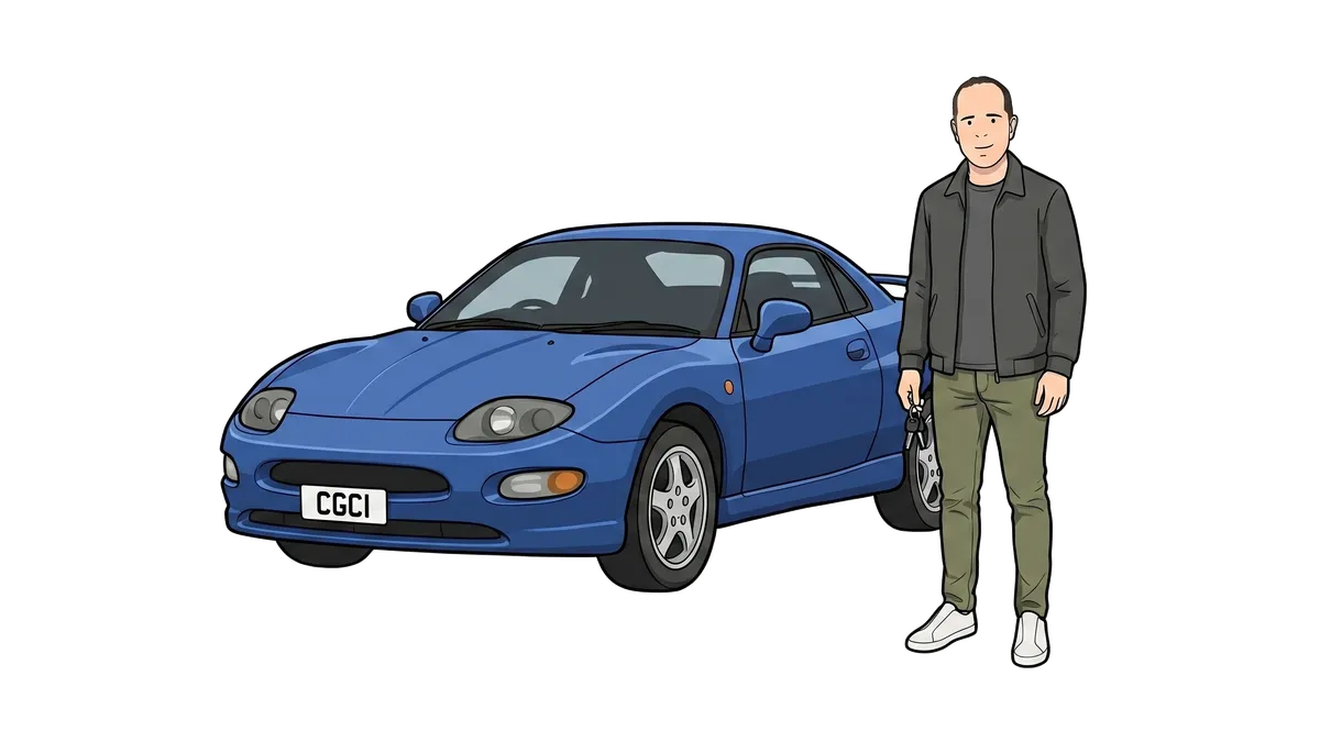 Ian holding keys beside an imported Mitsubishi FTO.