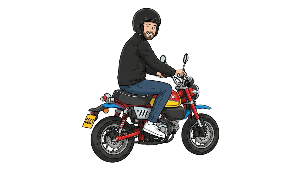 A rider on a small monkey bike mini motorbike.