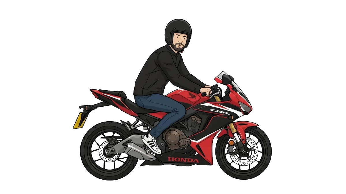 Josh riding a red sports motorbike.