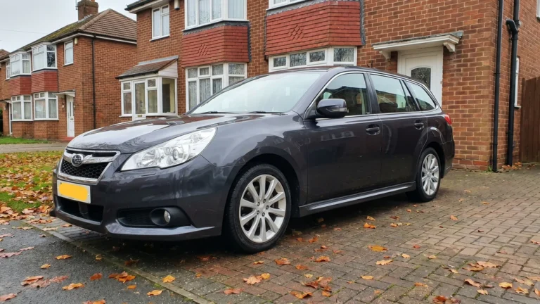 a clean imported car parked on a UK suburban driveway